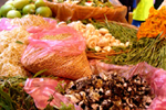 Figure 28. Cuitlacoche (Ustilago maydis) for sale with other mushrooms and vegetables in markets in Mexico City. (Courtesy Vladimir Casteñada) 